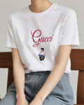 White Young Man Seated On Barrel Graphic T-Shirt - model wearing view