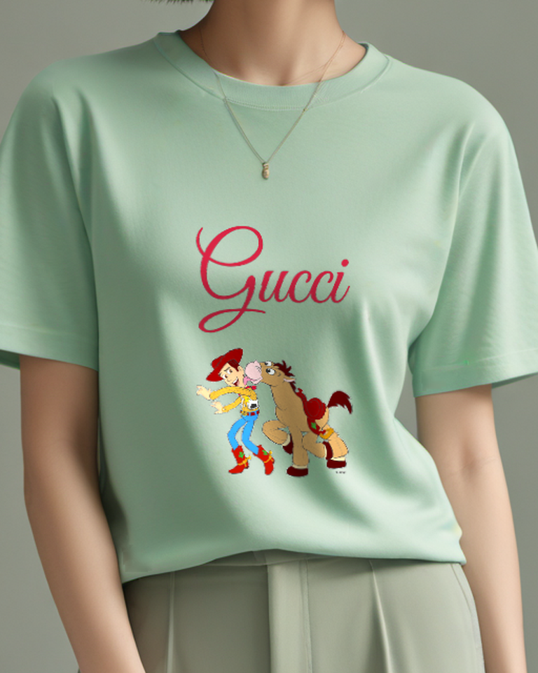 Sage Green Toy Cowboy And Horse In Playful Chase Graphic T-Shirt - model wearing view