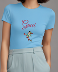 Sky Blue Pinocchio Running With Apple And Book Graphic T-Shirt - model wearing view
