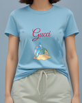 Sky Blue Blue Caterpillar Sitting Atop Leaf Alice Below Graphic T-Shirt - model wearing view