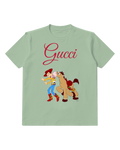 Sage Green Toy Cowboy And Horse In Playful Chase Graphic T-Shirt - front product view